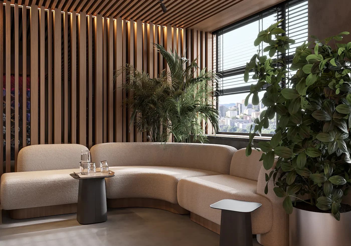 Bright office lounge with panoramic Barcelona views and custom curved sofa