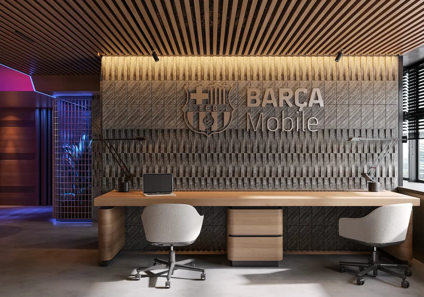 Branded office interior with BARÇA Mobile wall graphic and custom workstation