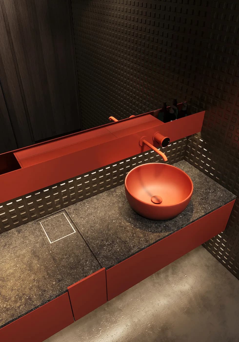 Close-up of the red vanity and custom basin in the BARÇA Mobile restroom