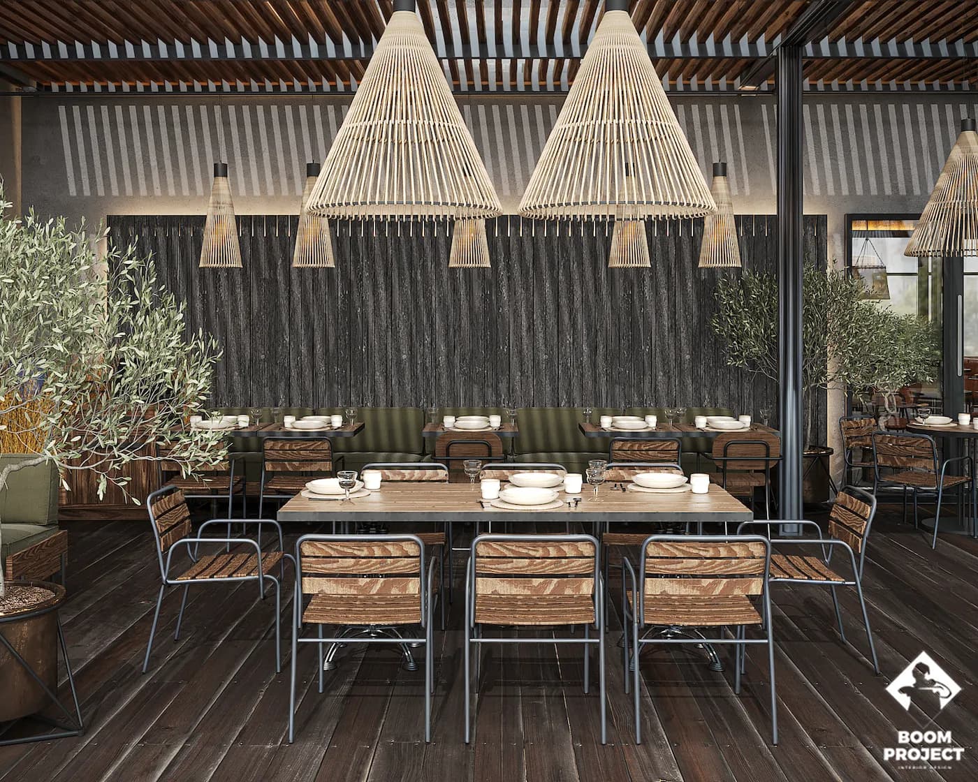 Communal dining table beneath sculptural rope installations and custom pendant lighting