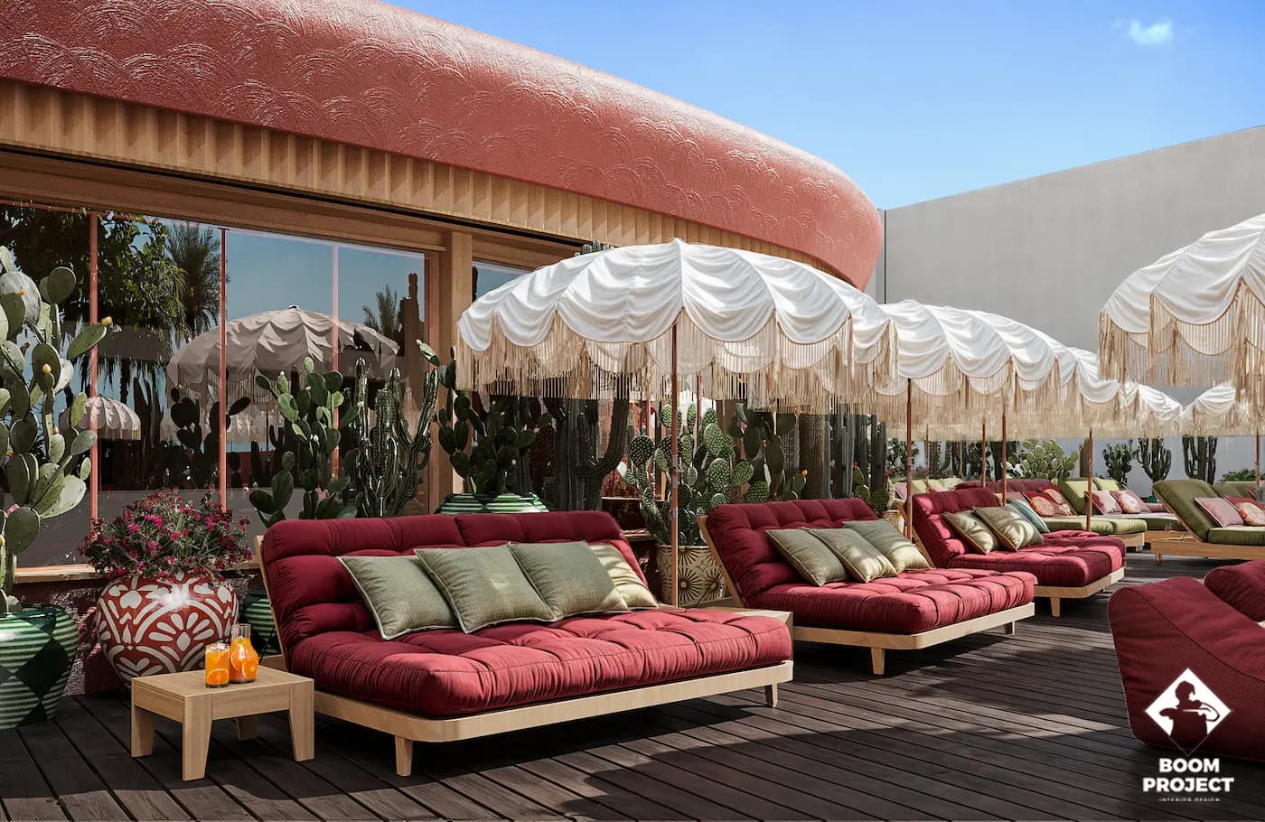 Outdoor lounge with deep red seating beneath a woven canopy
