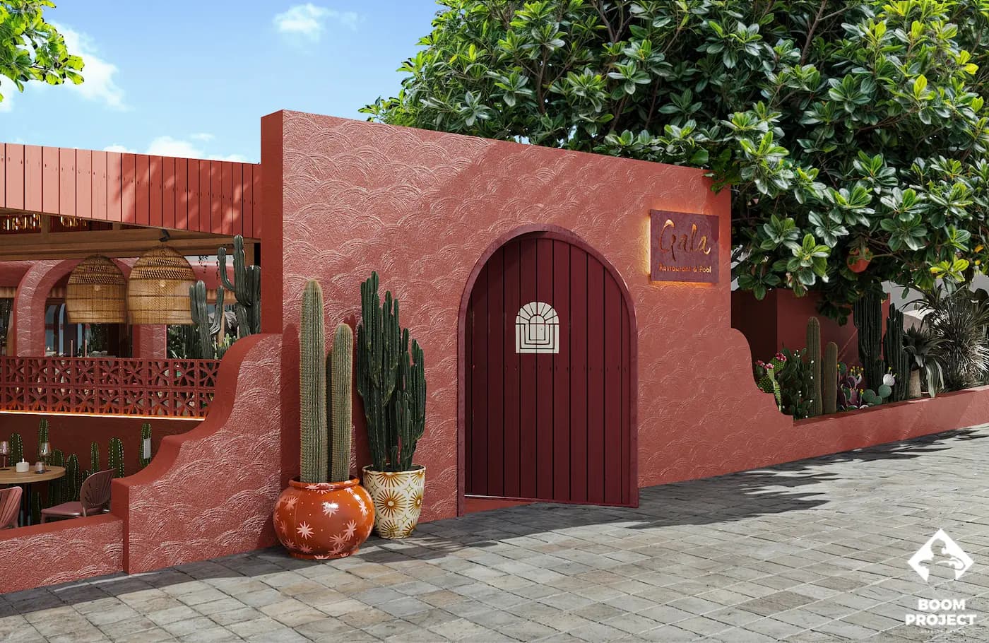 Sculptural terracotta entrance with arched doorways and desert planting