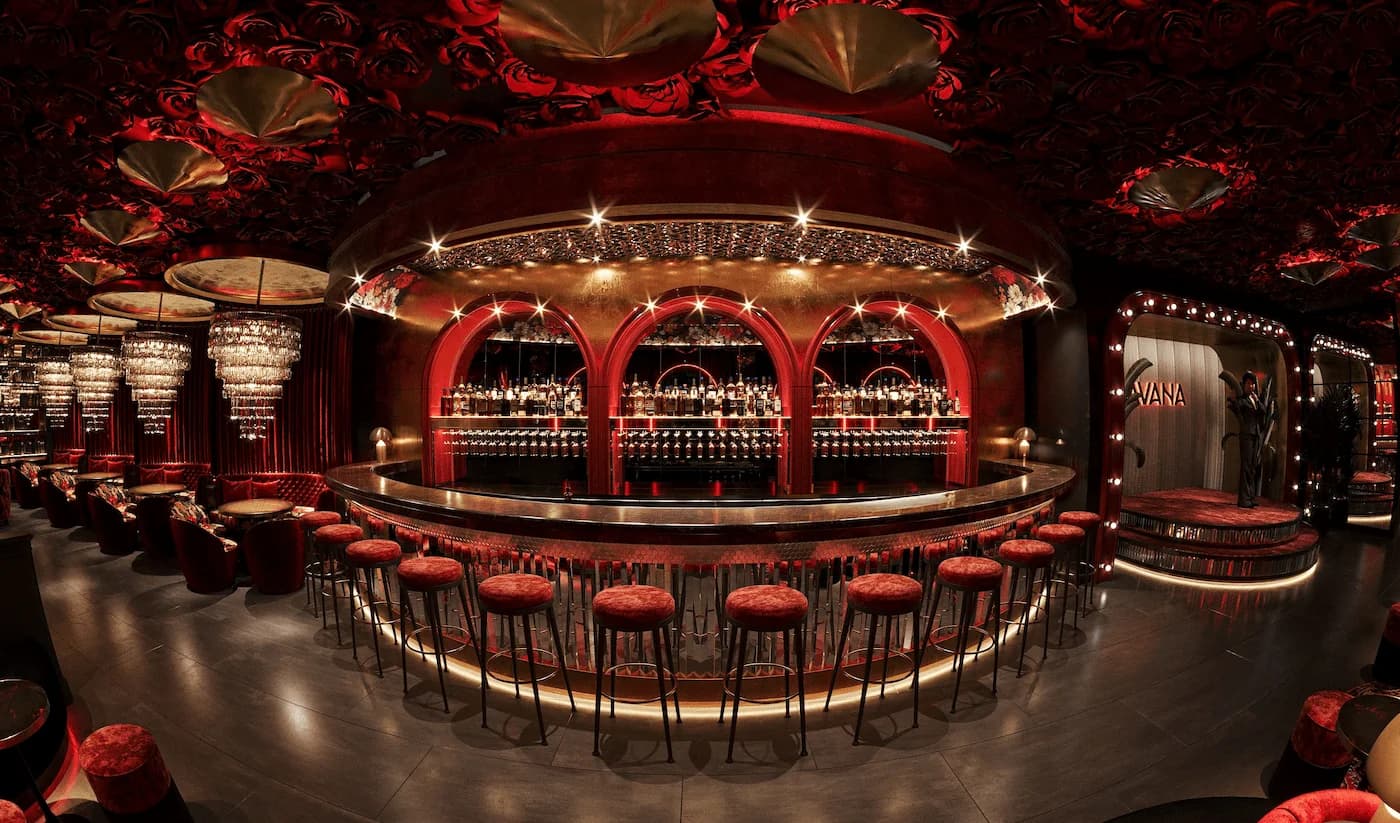 Havana restaurant bar in Kyiv with illuminated arches, rich red finishes, patterned details and sculptural crystal lighting