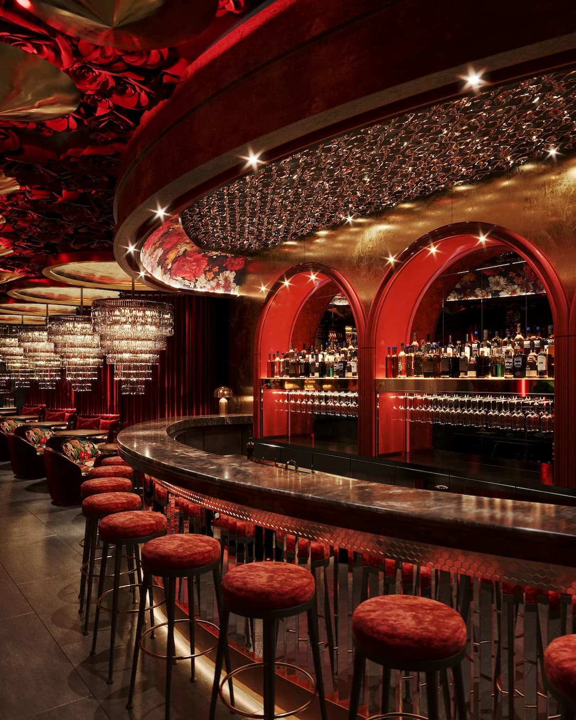 Havana restaurant bar with illuminated arches, rich red finishes and sculptural crystal lighting