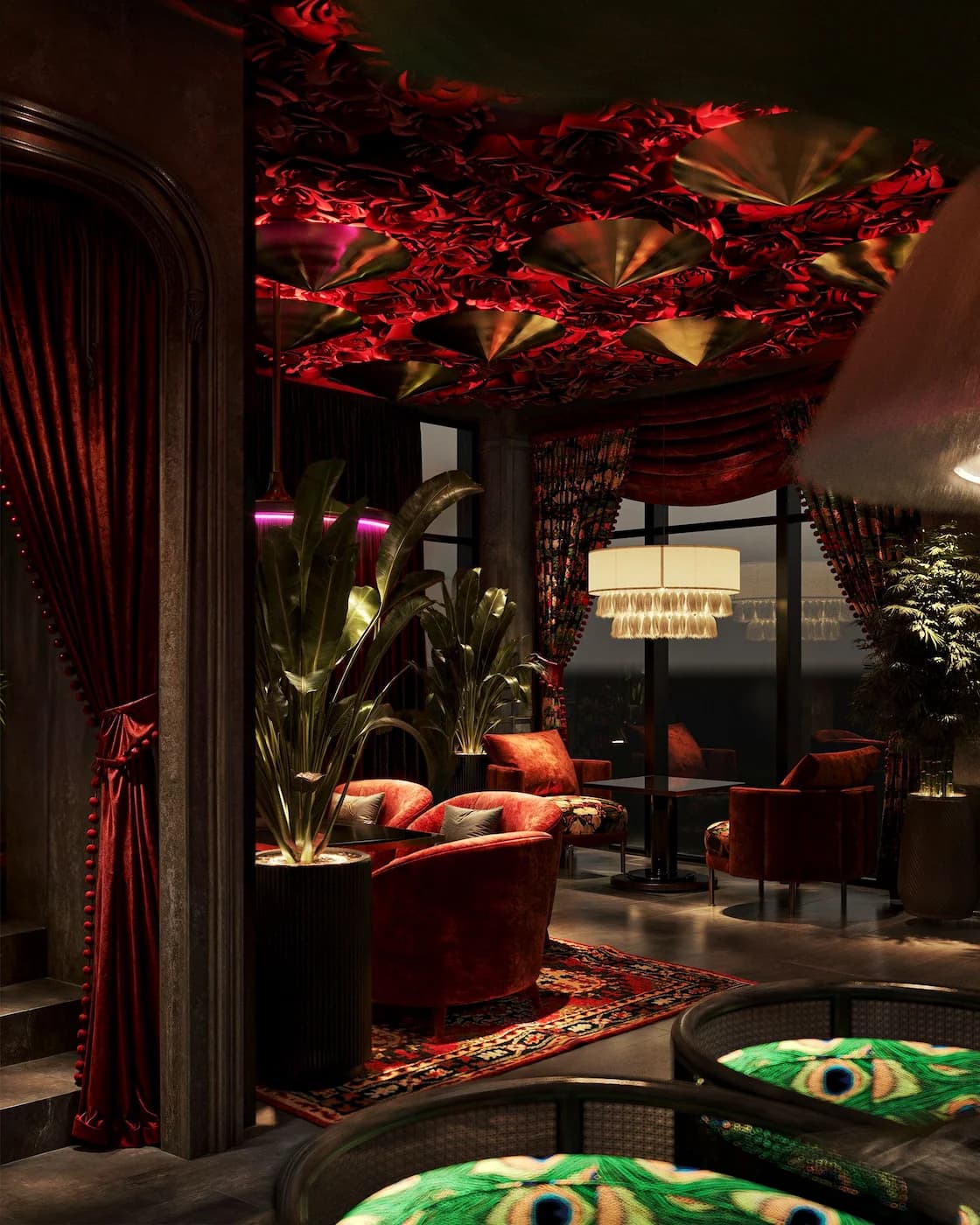 Tropical dining area with floral ceiling installation, patterned upholstery and lush greenery
