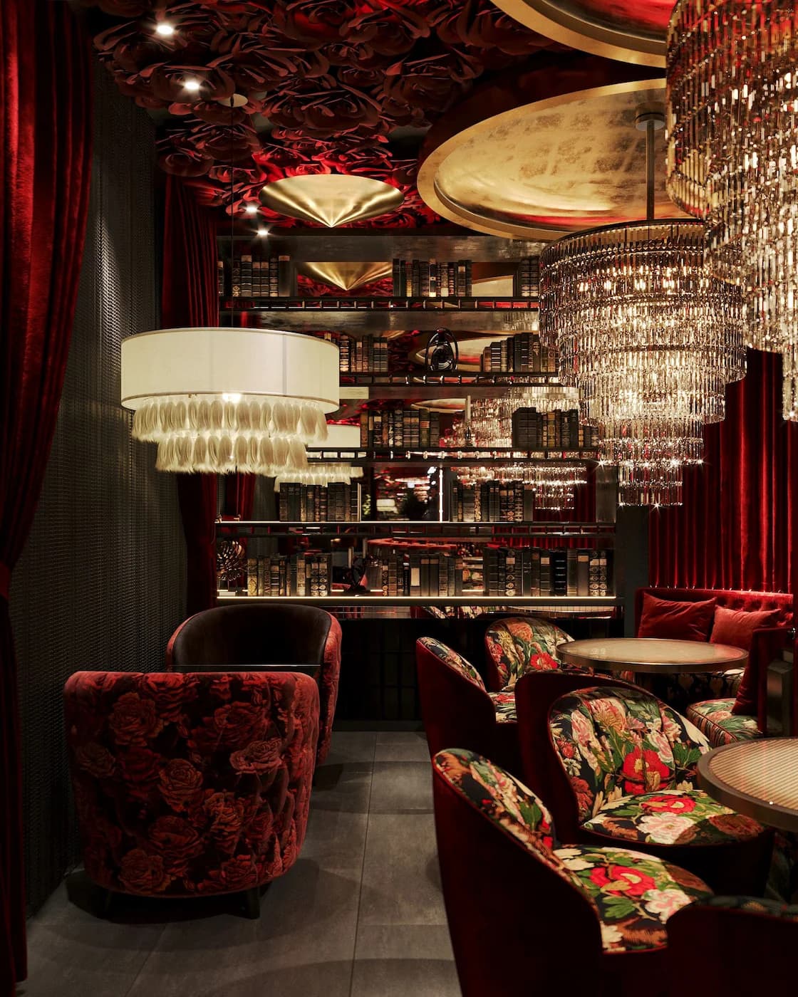Havana dining space with mirrored bar display, tropical upholstery and layered warm lighting