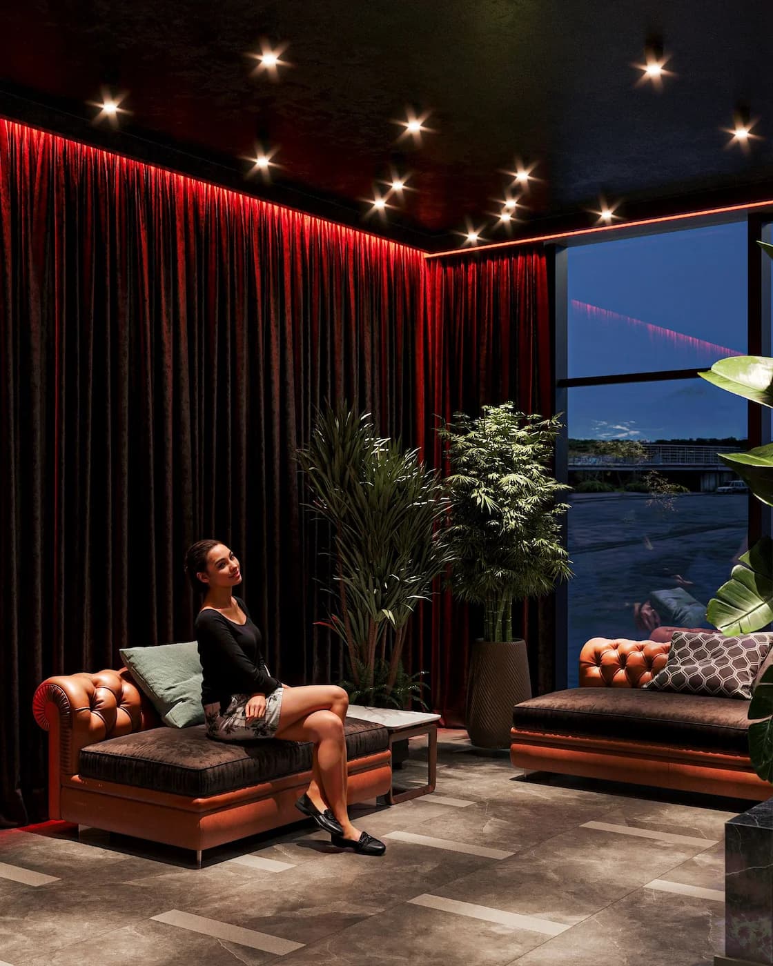 Havana seating area with tropical furniture, indoor planting and panoramic windows