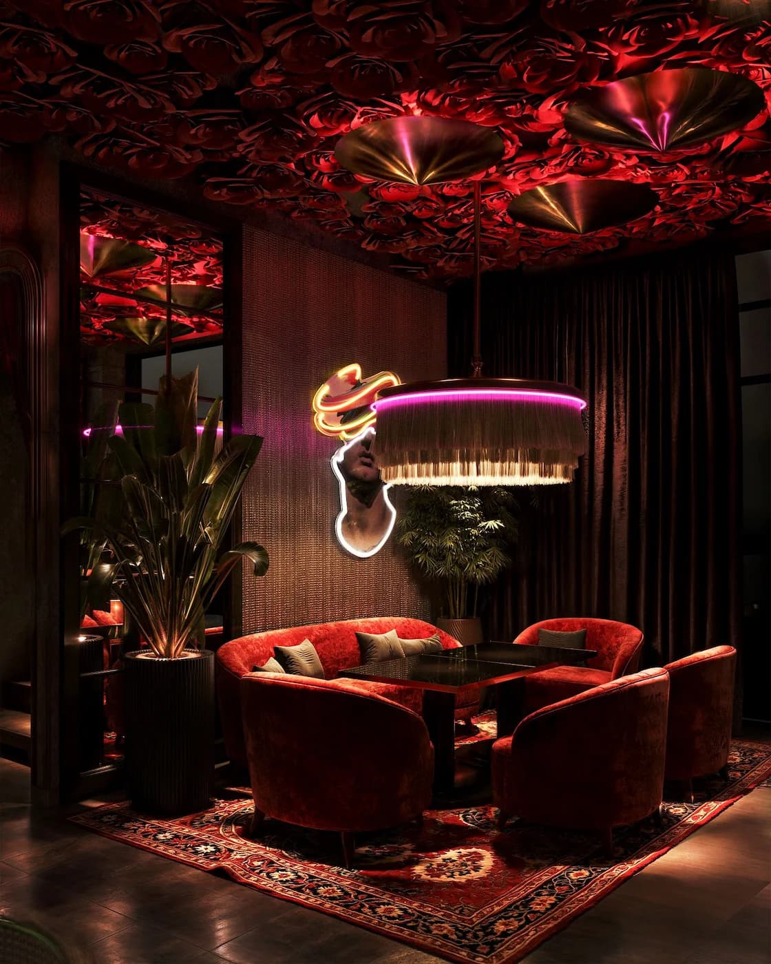 Sculptural flamingo light installation above colourful lounge seating in Havana