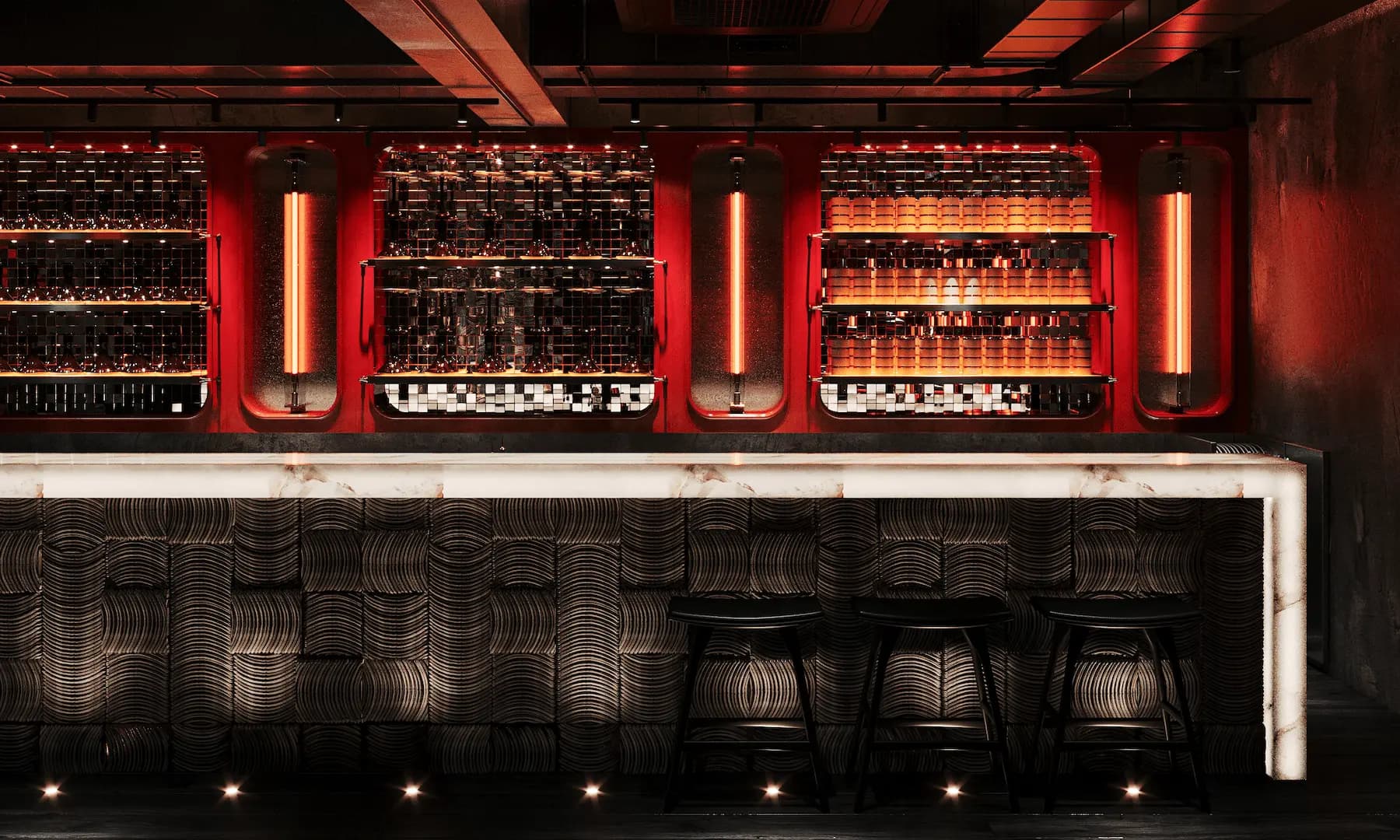 Commercial restaurant interior with decorative stone wall and custom bar