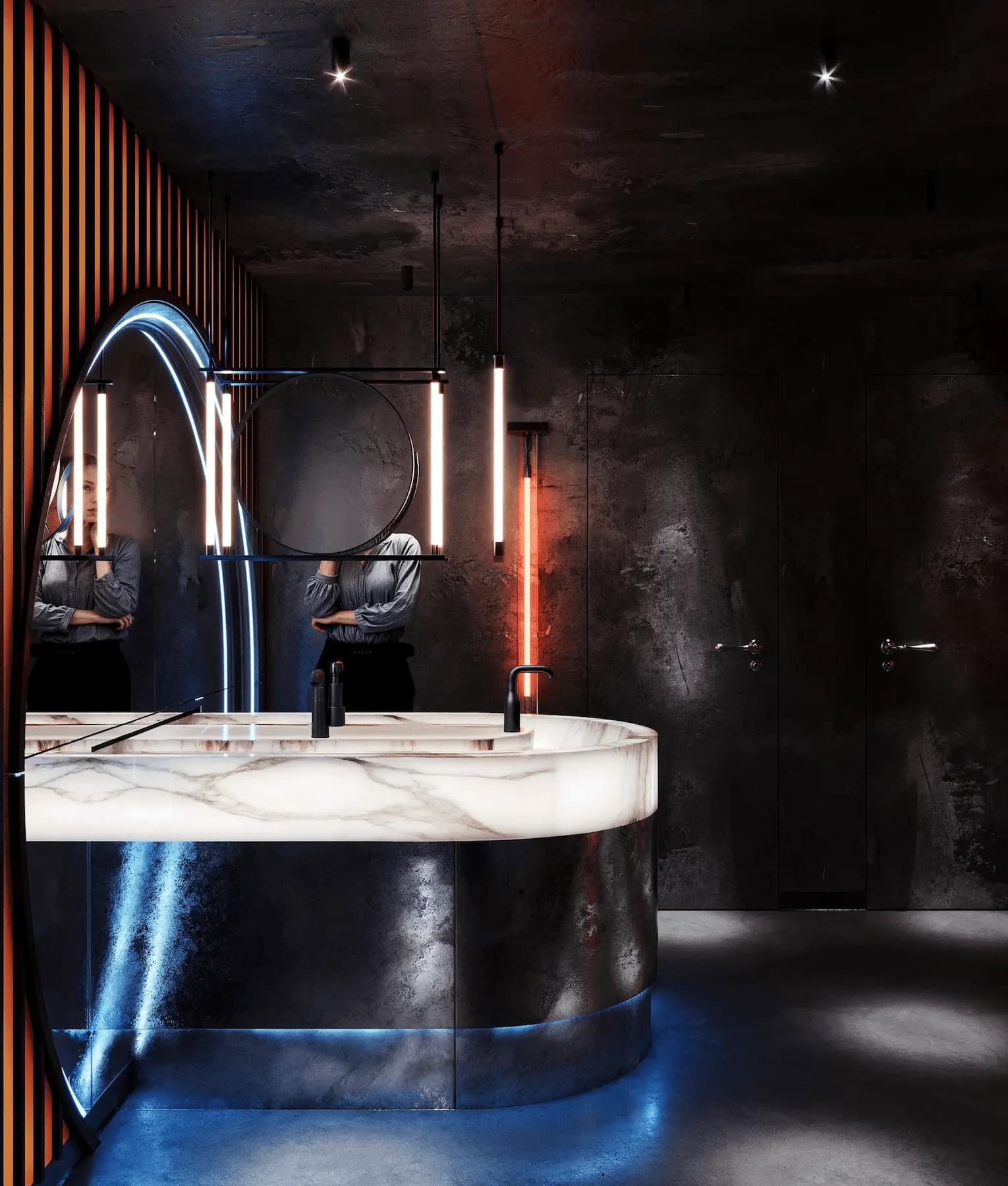 Designer restroom with backlit marble vanity and architectural lighting
