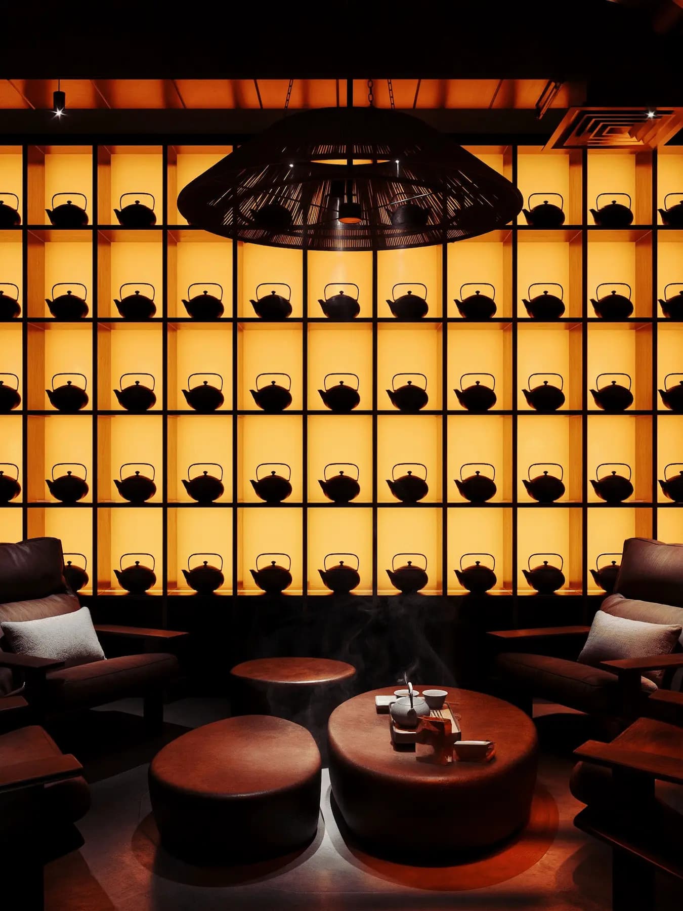 Japanese tea lounge with illuminated shelving and ceremonial atmosphere