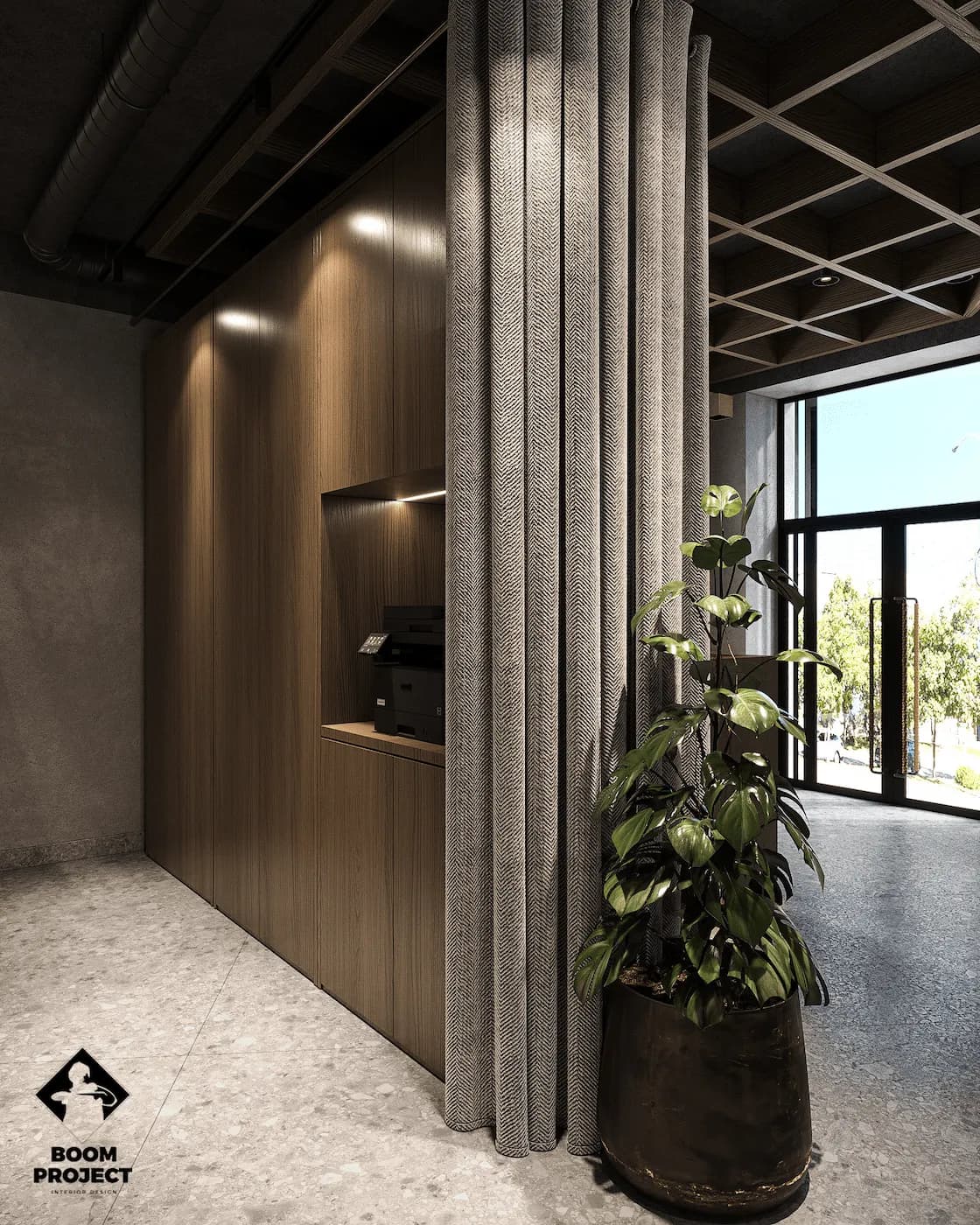 Close-up of patterned metal partition beside panoramic office glazing and indoor planting
