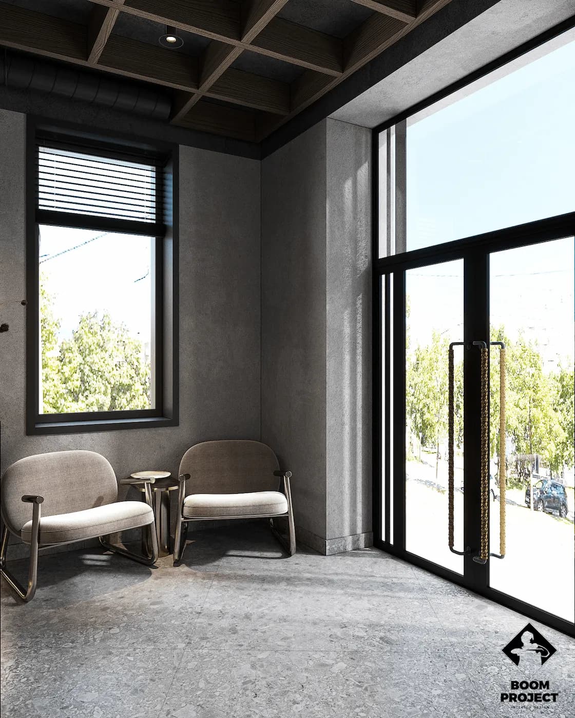 Quiet office lounge with upholstered armchairs, timber wall panels and full-height windows