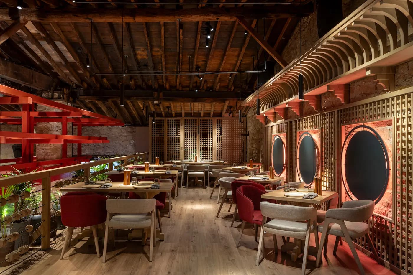 Lila Izakaya dining space with sculptural rattan ceiling installation and warm ambient lighting