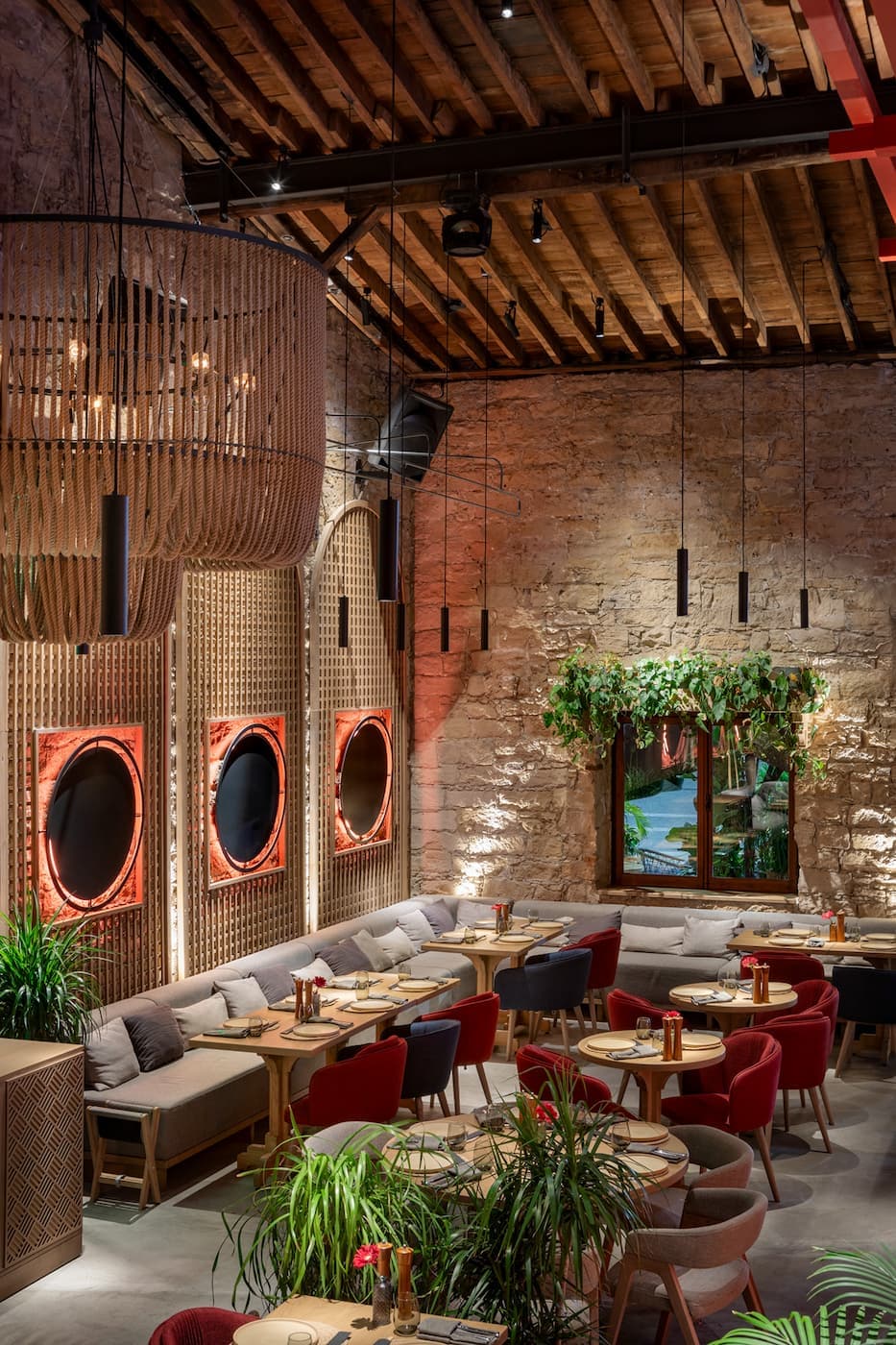 Lila Izakaya intimate dining space framed by textured stone and warm timber