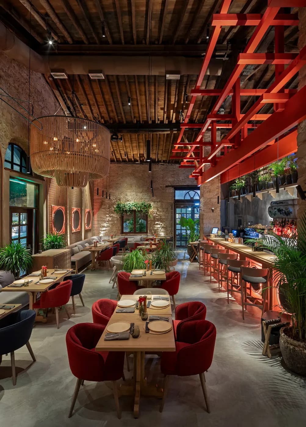 Lila Izakaya dining room beneath a sculptural rattan ceiling installation
