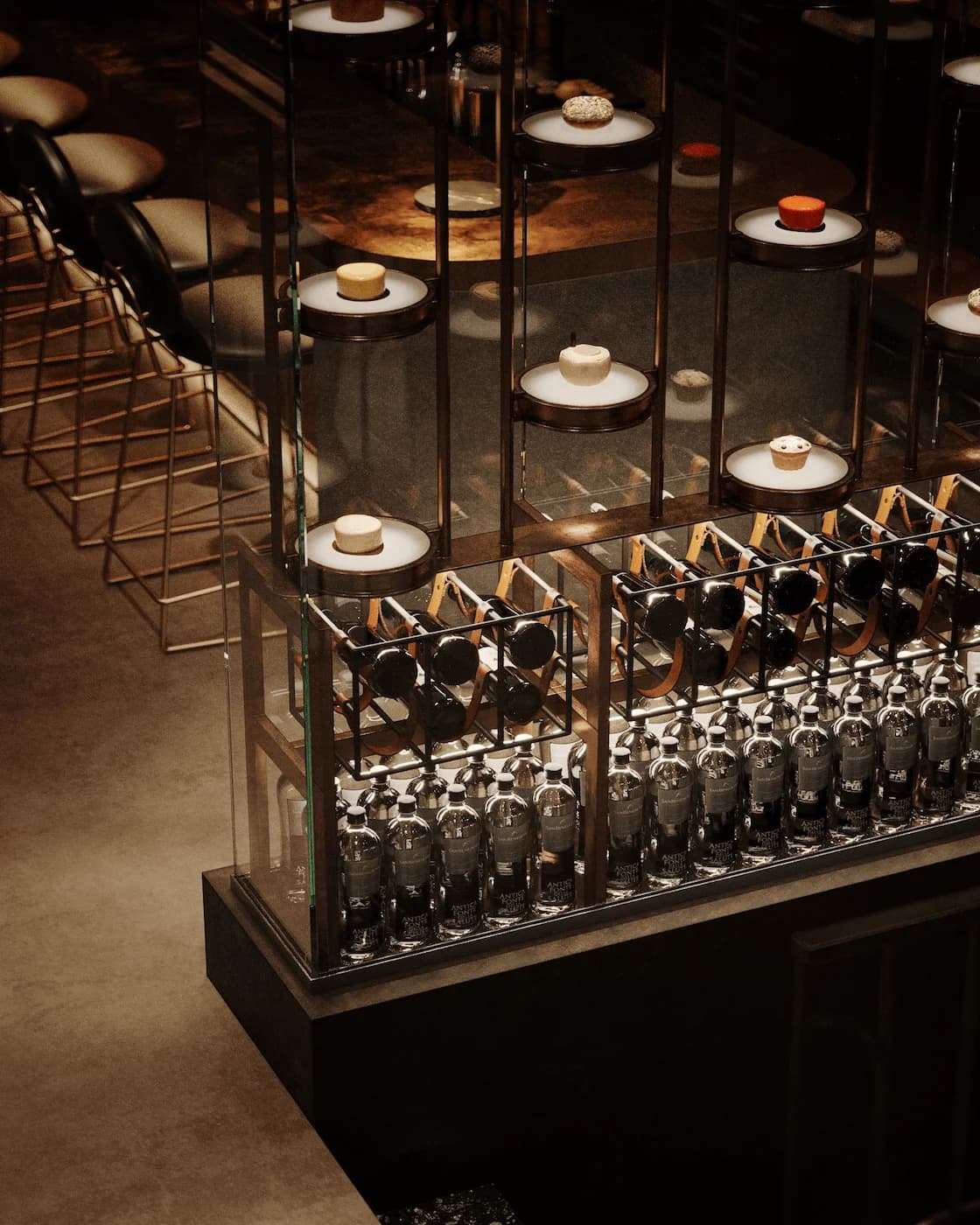 Decorative metal balustrade with suspended circular lights and symbolic details