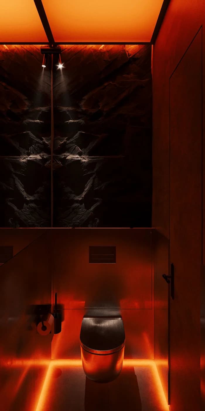 Atmospheric red-lit niche with sculptural wall relief and integrated floor lighting