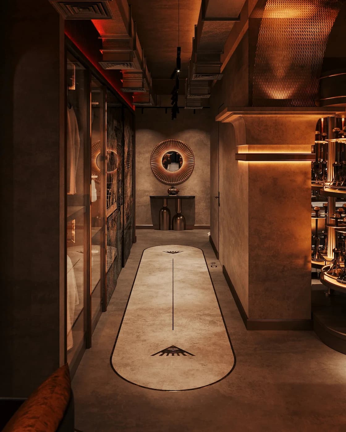 Long interior corridor with stone flooring, bronze details and curated objects