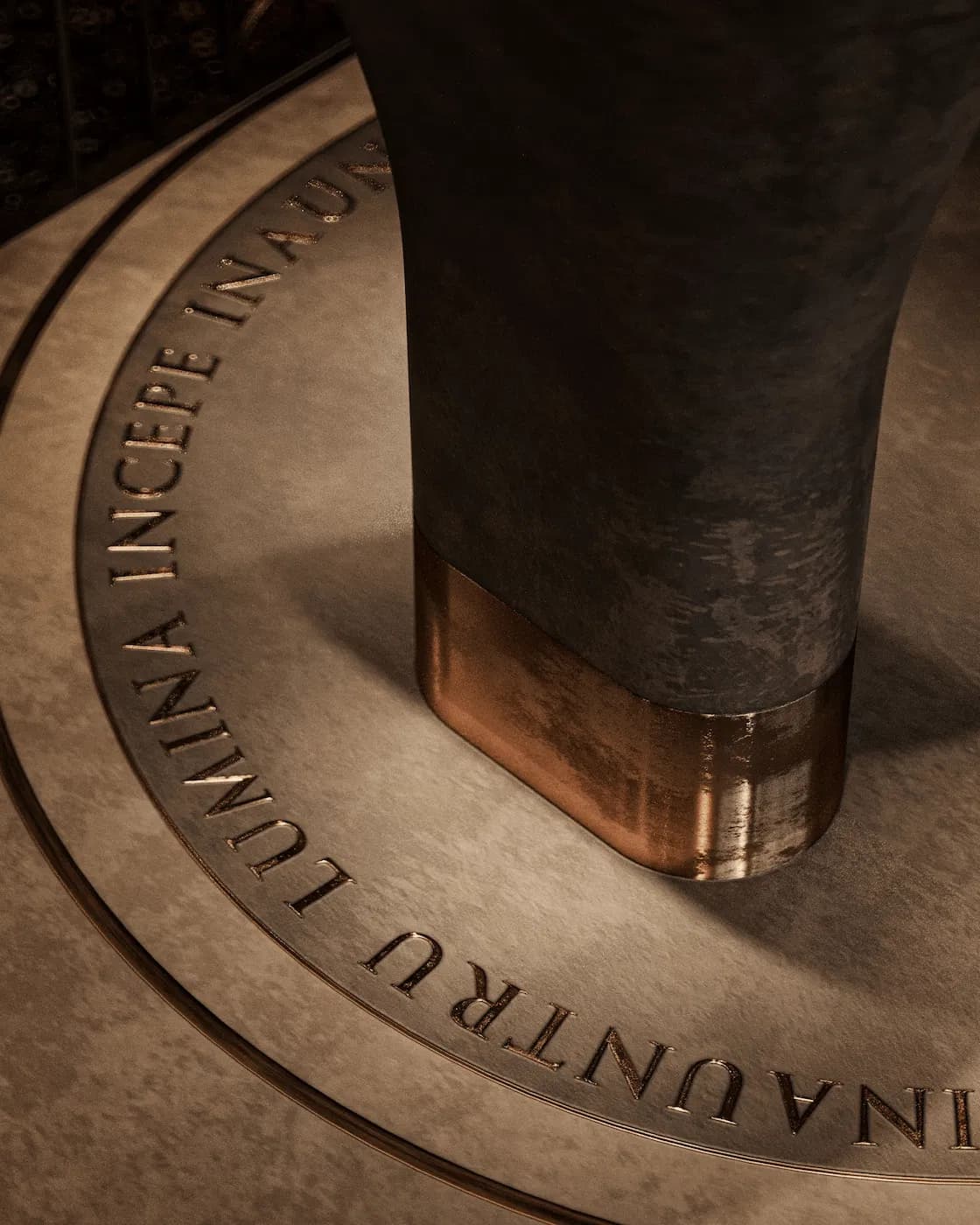 Close-up of engraved stone flooring with a symbolic Latin inscription