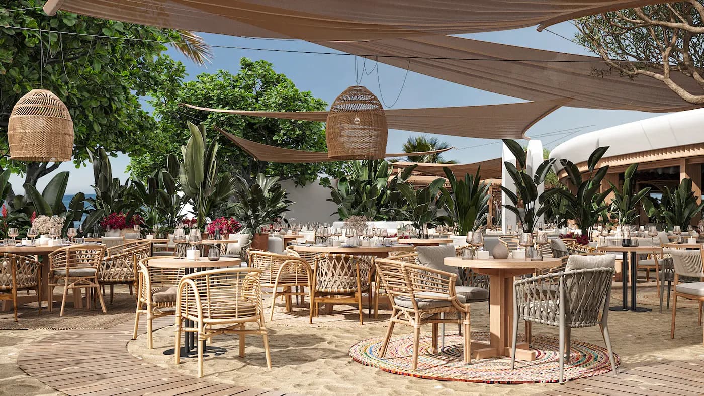 Garden restaurant seating with woven chairs and Mediterranean planting