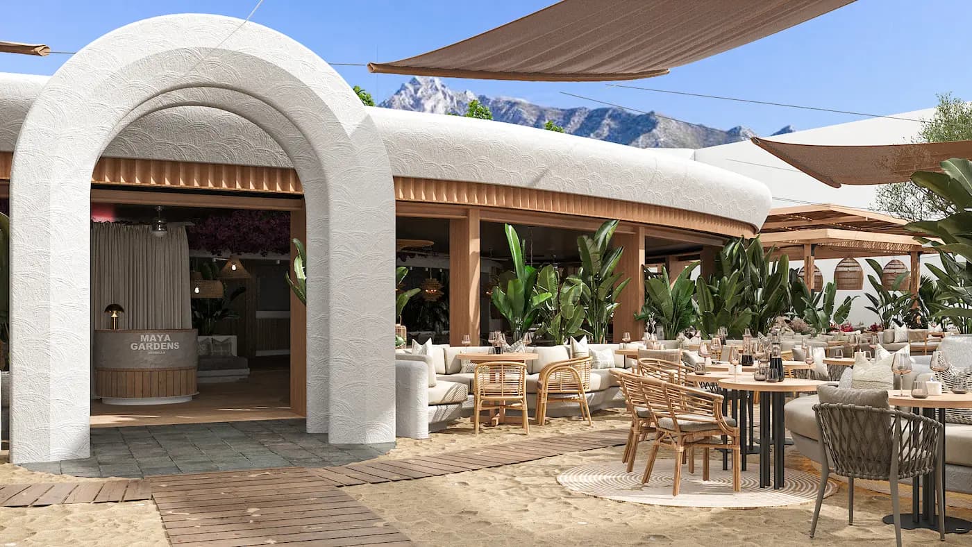 Maya Garden Marbella open-air restaurant with white textured arches, timber pergolas, natural furniture and lush Mediterranean planting