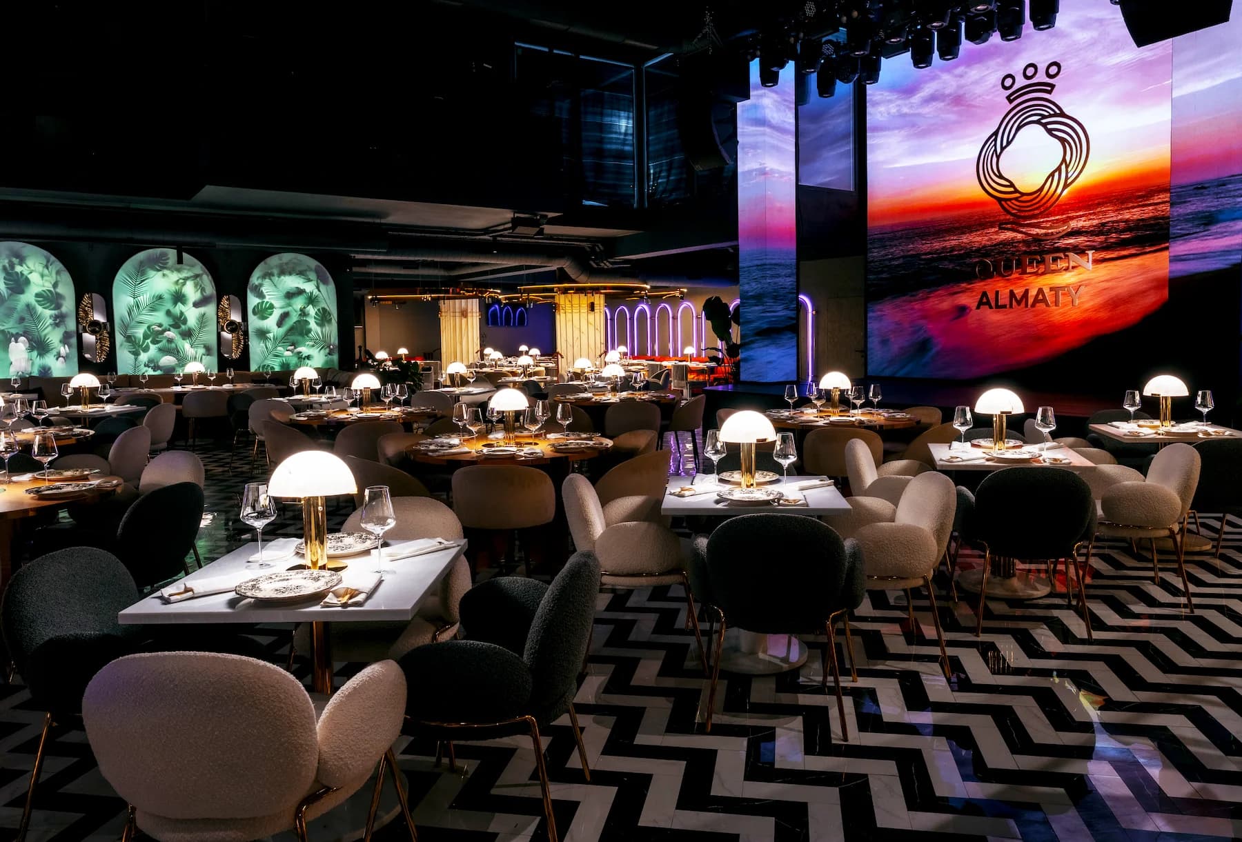Panoramic view of the ballroom with elevated stage and geometric black-and-white flooring