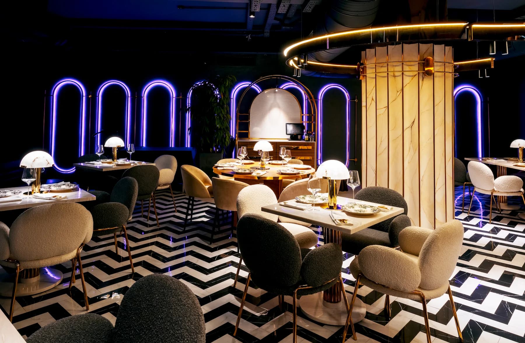 Asian restaurant interior with decorative screens, intimate tables and natural finishes