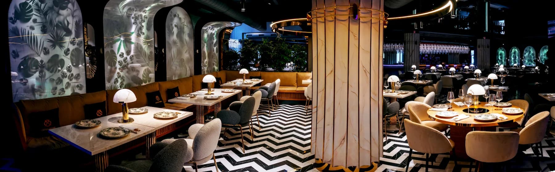 Contemporary dining room with warm timber, custom seating and decorative lighting