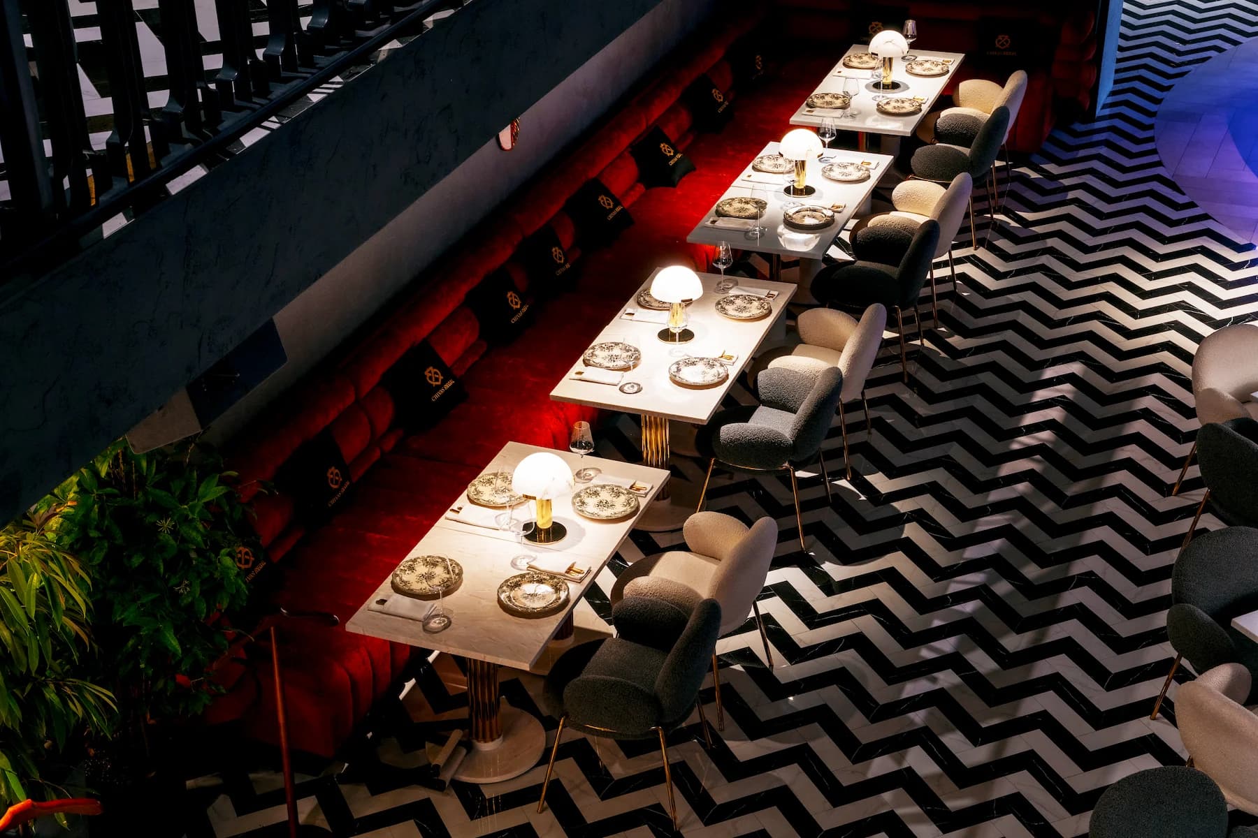 Queen Restaurant Complex in Almaty with graphic flooring, refined table settings and dramatic contemporary lighting