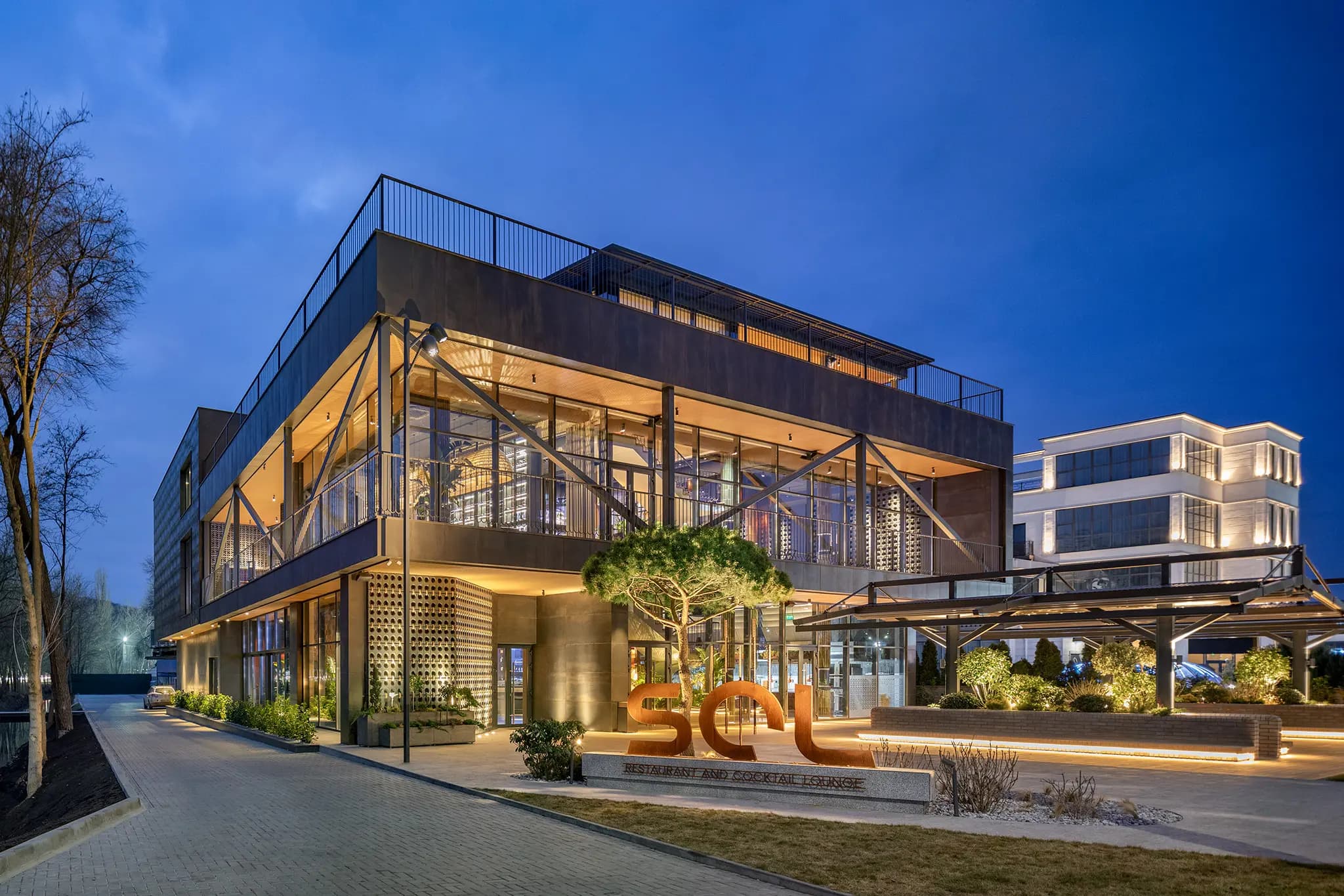 Restaurant exterior illuminated at dusk in Chișinău