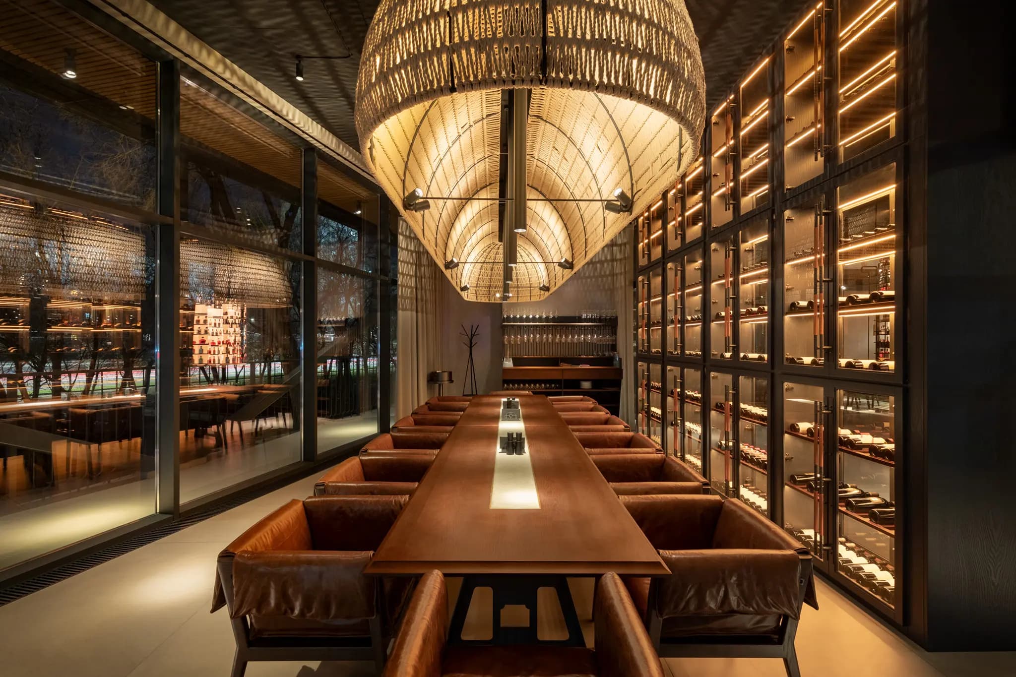 Long communal dining table with dramatic ceiling installation