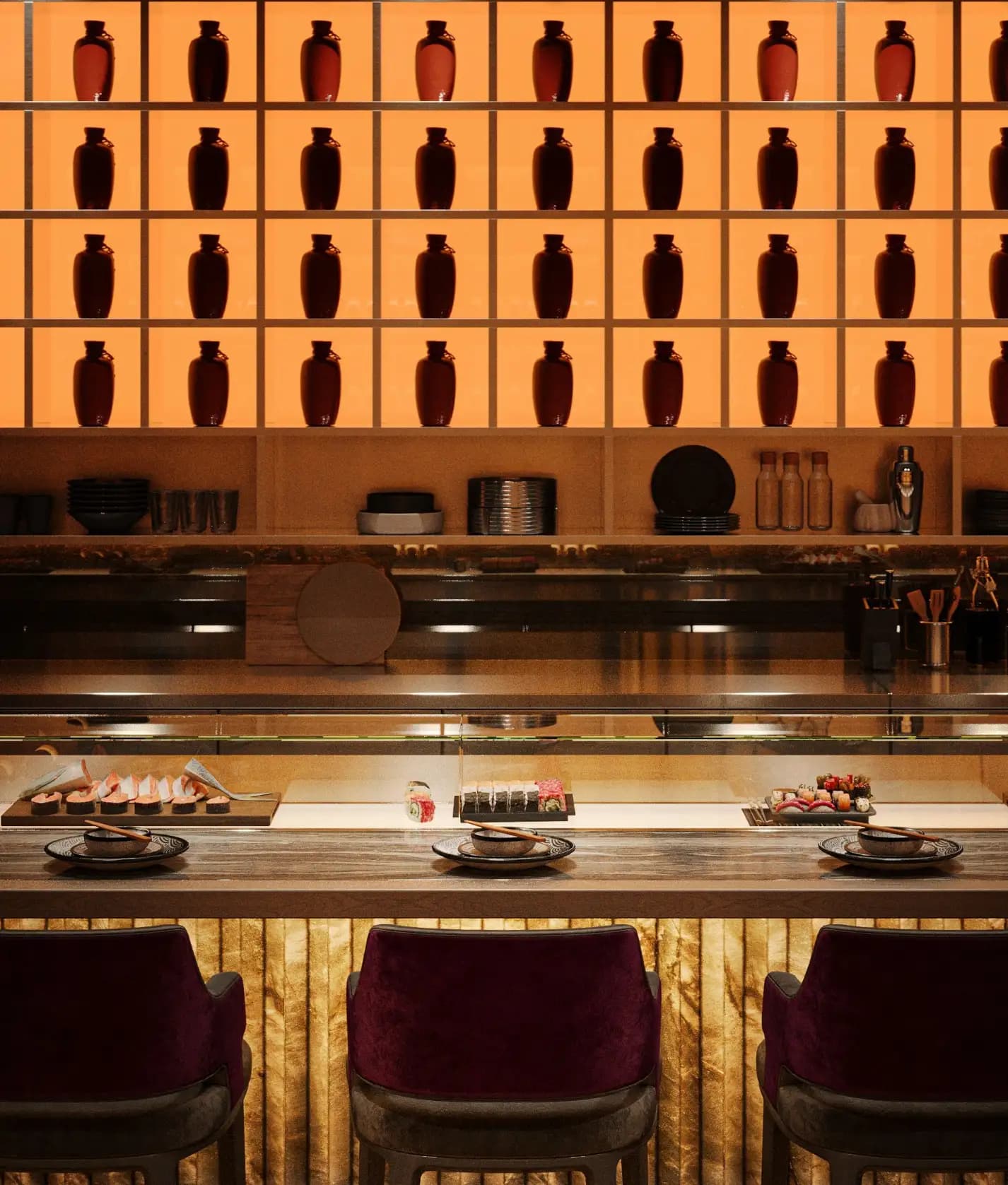 Backlit bottle display wall behind the Zaxi Restaurant sushi counter with warm amber lighting and food presentation
