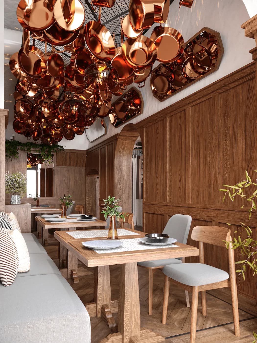 Compact restaurant seating beside timber wall panels and suspended copper decor