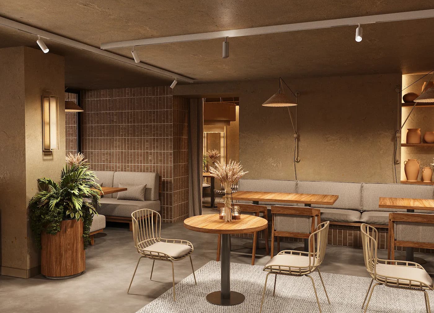 Open pastry display with integrated shelving, warm lighting and visible bakery production