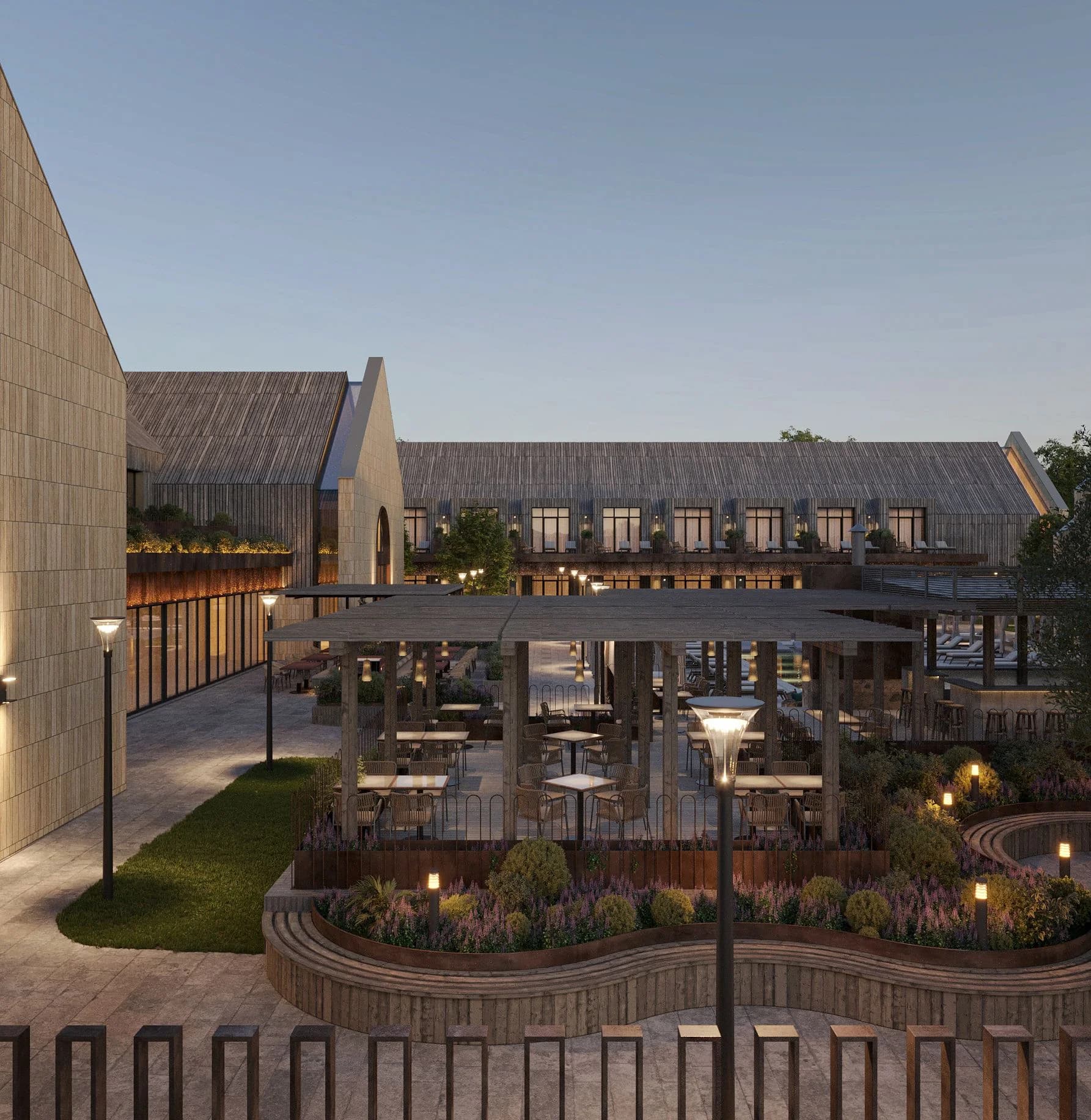 Courtyard of the Shampan complex with a lounge area and landscaping between buildings