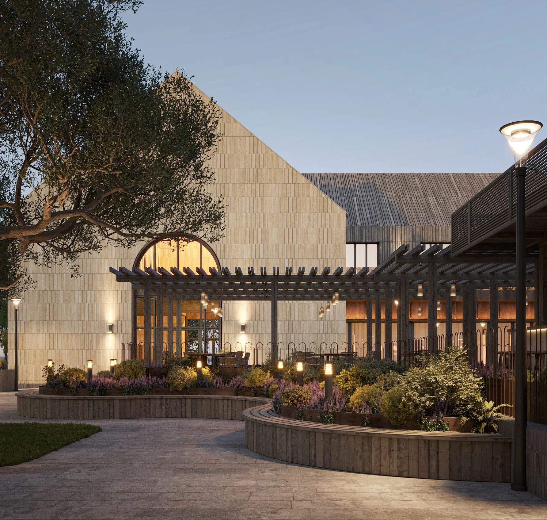 Entrance facade of the Shampan winery with stone masonry and warm lighting