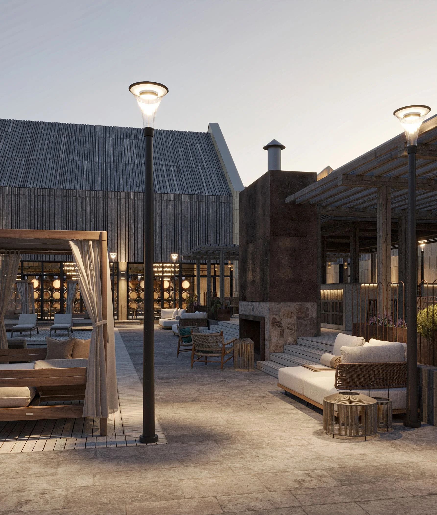 Outdoor lounge area with daybeds and street lamps in the Shampan courtyard