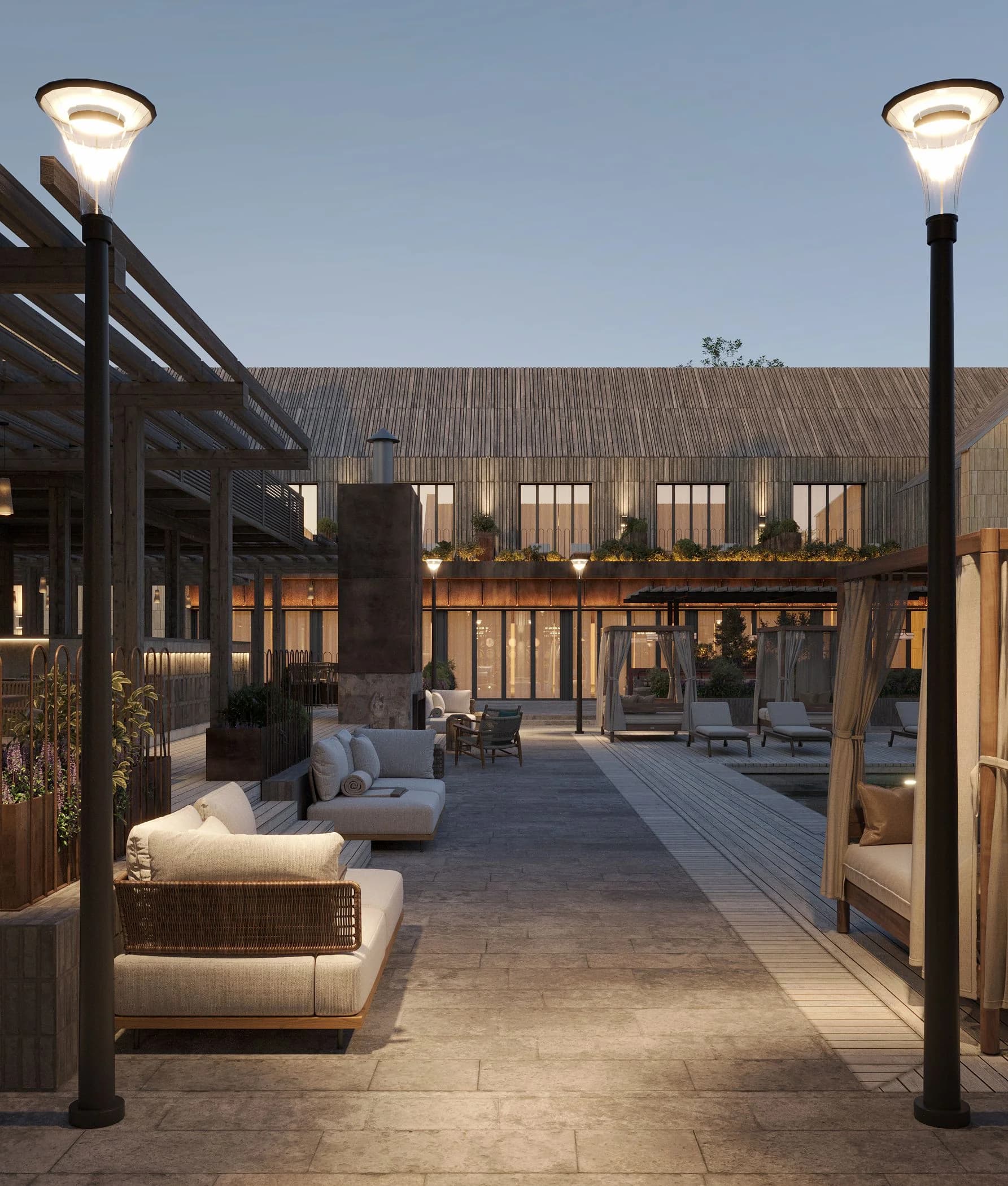 Lounge area with sofas under a pergola against a textured facade